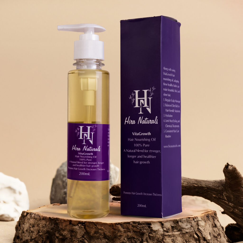 Bottle of Vitagrowth Hair Nourishing Oil by Hira Naturals, displayed with coconut, olive, blackseeds, and rosemary, highlighting its herbal hair growth benefits.
