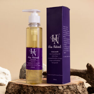 Bottle of Vitagrowth Hair Nourishing Oil by Hira Naturals, displayed with coconut, olive, blackseeds, and rosemary, highlighting its herbal hair growth benefits.