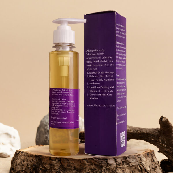 Bottle of Vitagrowth Hair Nourishing Oil by Hira Naturals, displayed with coconut, olive, blackseeds, and rosemary, highlighting its herbal hair growth benefits.