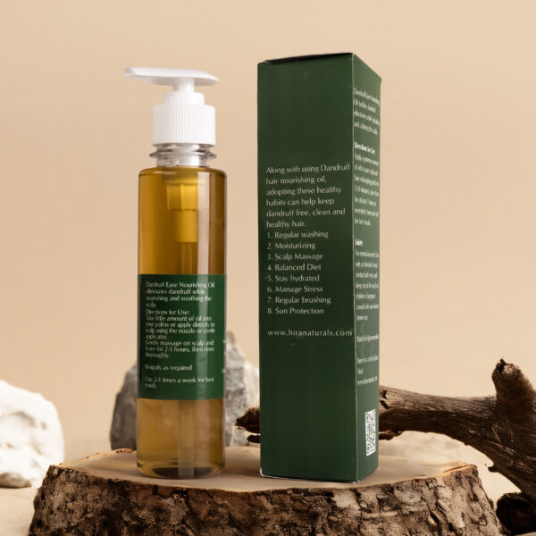Bottle of Dandruff Ease Hair Nourishing Oil by Hira Naturals, shown with neem leaves, fenugreek, and rose petals, highlighting its herbal anti-dandruff properties.