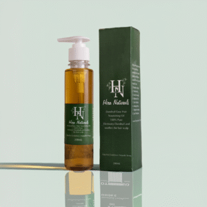 Bottle of Dandruff Ease Hair Nourishing Oil by Hira Naturals, shown with neem leaves, fenugreek, and rose petals, highlighting its herbal anti-dandruff properties.