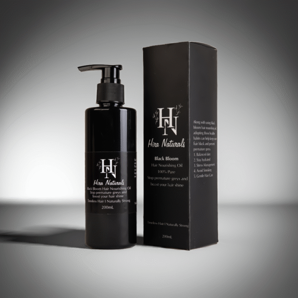 Bottle of Black Bloom Hair Nourishing Oil by Hira Naturals placed on a clean background, showcasing herbal ingredients for strengthening and shine.