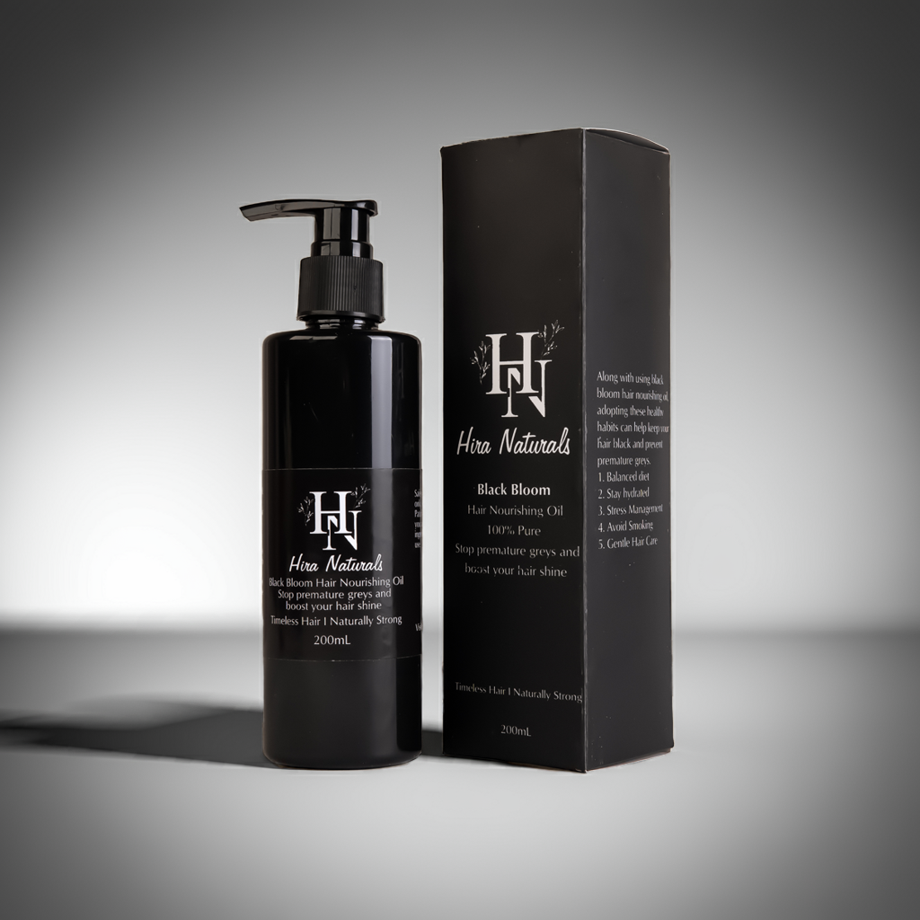 Bottle of Black Bloom Hair Nourishing Oil by Hira Naturals placed on a clean background, showcasing herbal ingredients for strengthening and shine.